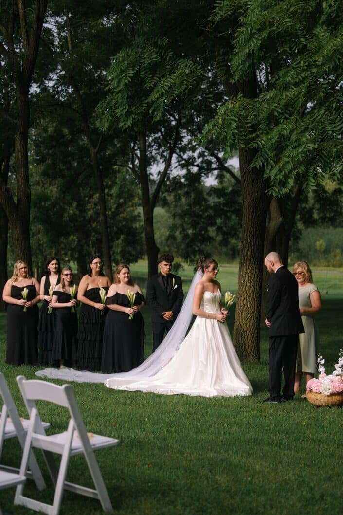 Bride and groom exchanging vows at their Wisconsin wedding