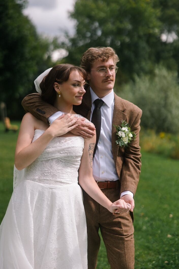 Shannon and John taking wedding portraits outdoors at Homestead Hollow County Park.