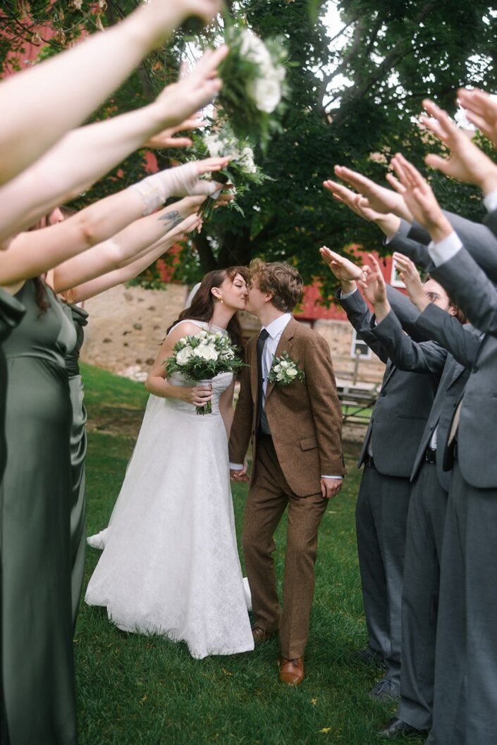 Shannon and John celebrating with family and friends at their September wedding