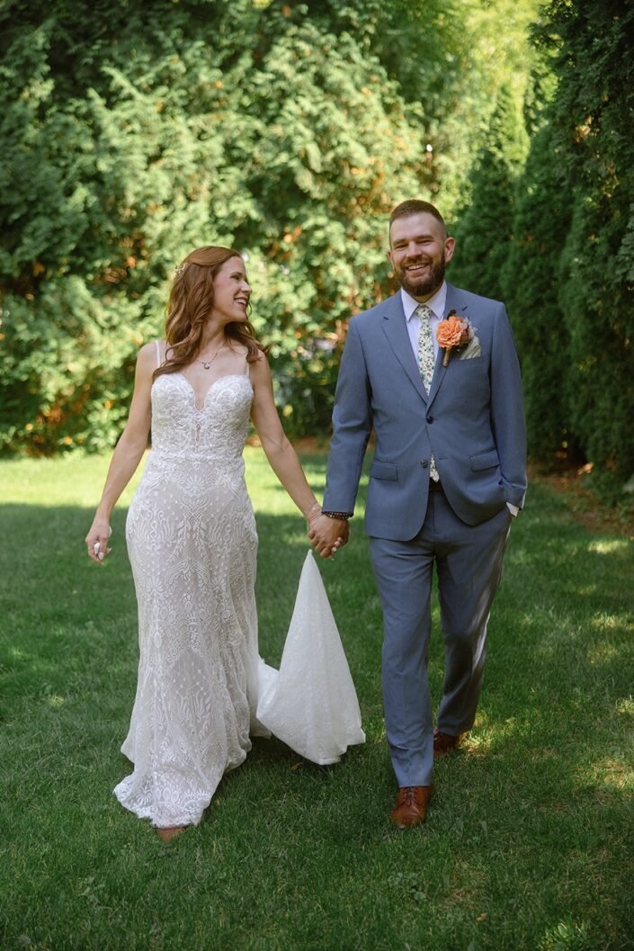 Cheryl and Jon posing outdoors among the trees at their Cedarburg wedding