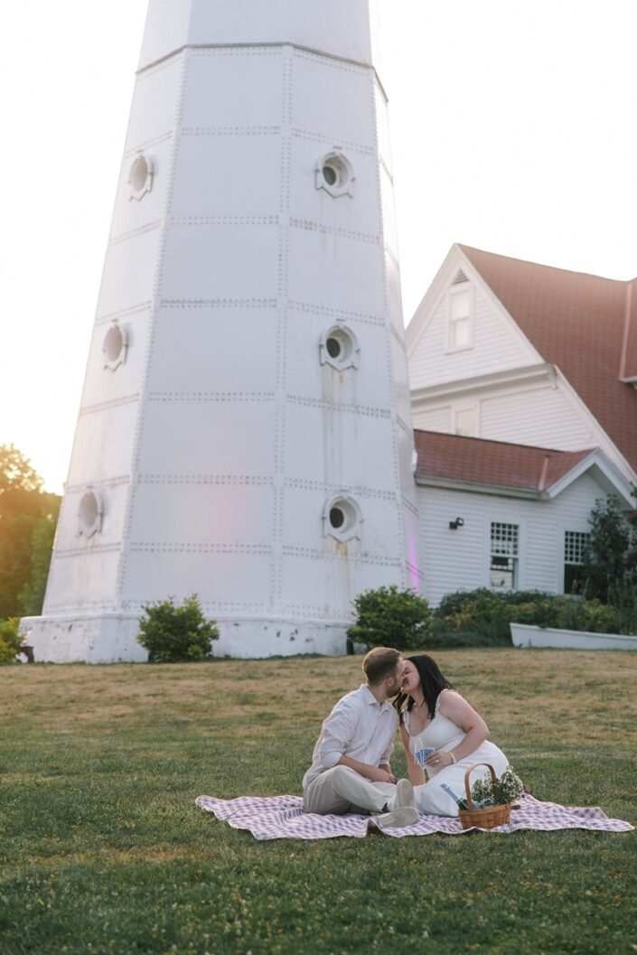 Lexi and Ty enjoying a picnic together near the Lake Park lighthouse