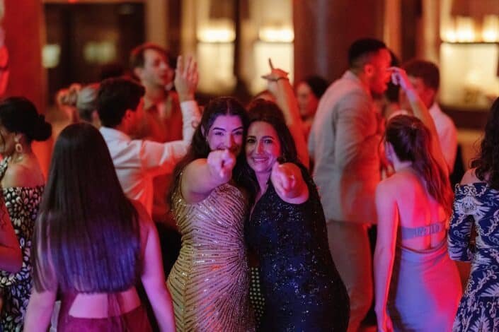 Guests laughing and celebrating at E + O’s engagement party at The Pfister Hotel