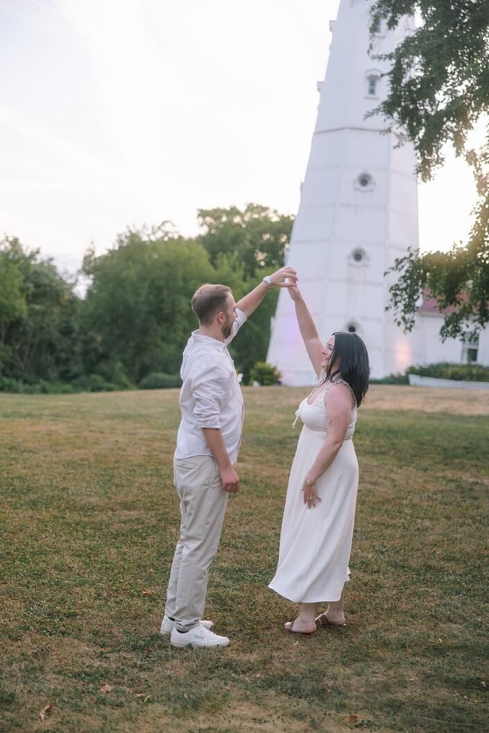 Lexi and Ty dancing near the Lake Park lighthouse