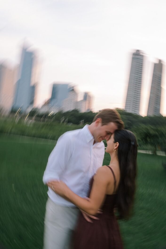 Darya and Charlie celebrating their engagement at Veterans Park in Milwaukee